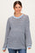 woman wearing a navy and light blue striped maternity top with long sleeves and side slits, featuring a relaxed fit