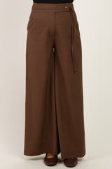 woman wearing brown wide-leg maternity pants with a tied waistband