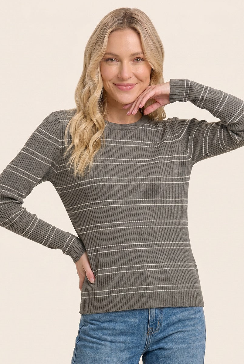 woman wearing a gray striped long sleeve sweater with a crew neckline and a relaxed fit