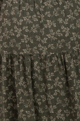 maternity wear in dark green with small floral print and tiered ruffle detailing