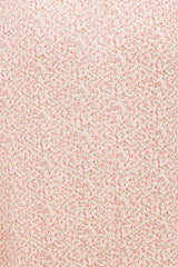 maternity wear in light pink floral printed fabric with small flowers throughout