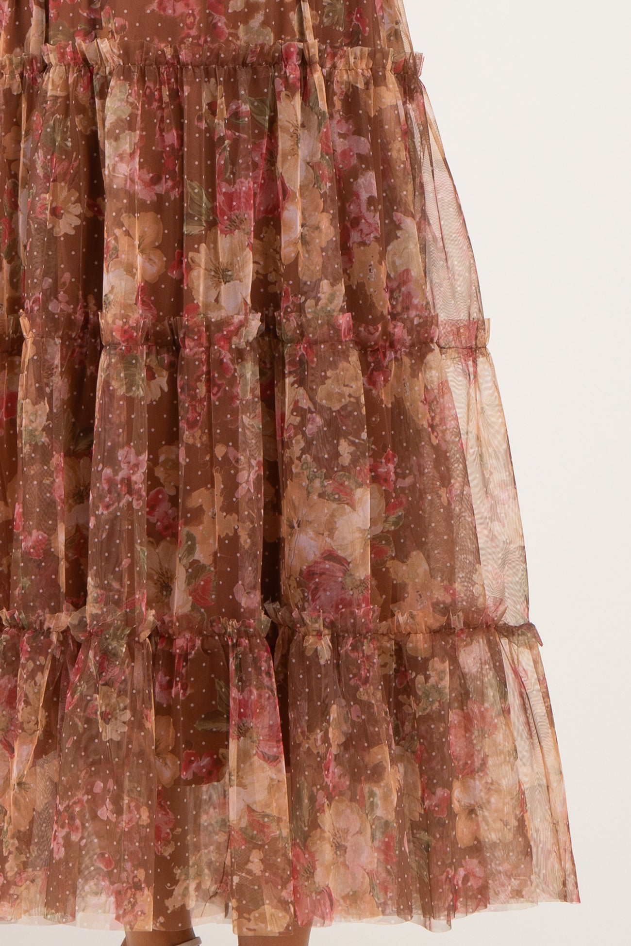 maternity wear floral tiered skirt in brown with pink and green accents, featuring sheer fabric and ruffle details