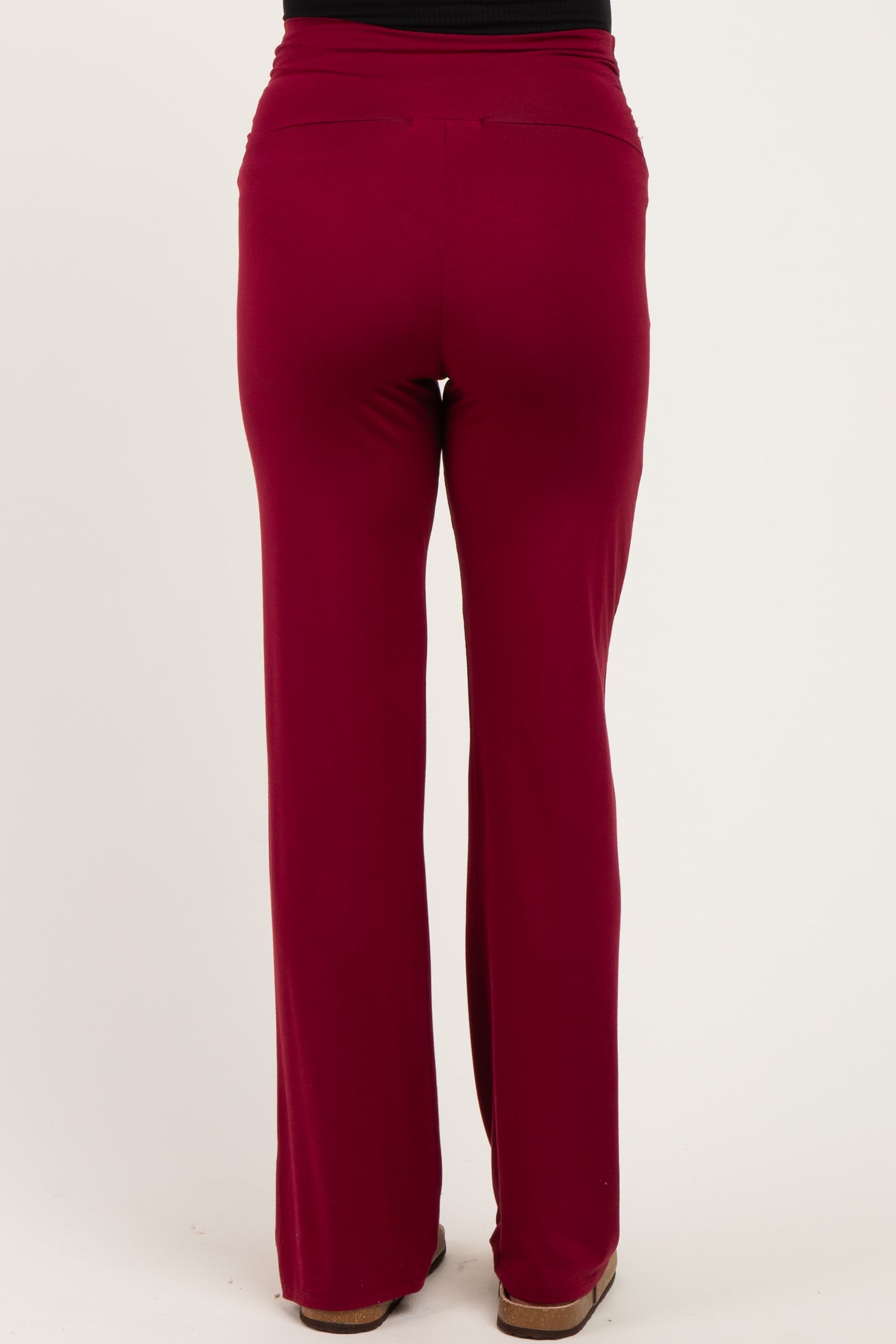 maternity wear in maroon wide-leg pants showing the back view