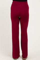maternity wear in maroon wide-leg pants showing the back view