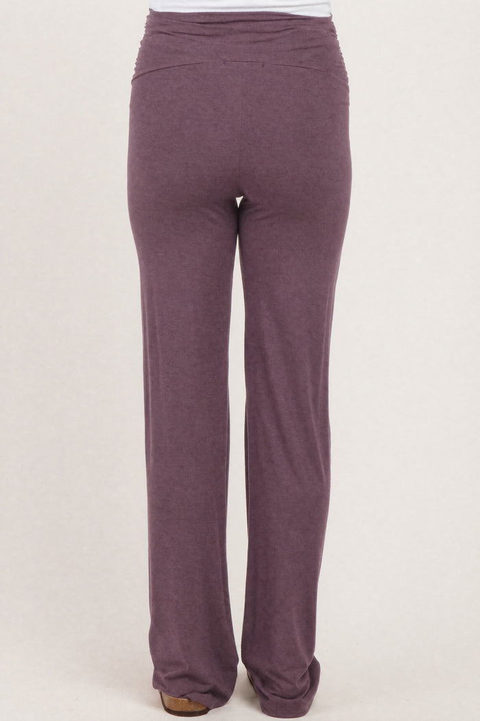 maternity wear in a plum color with ruched detailing at the back, shown from the back view