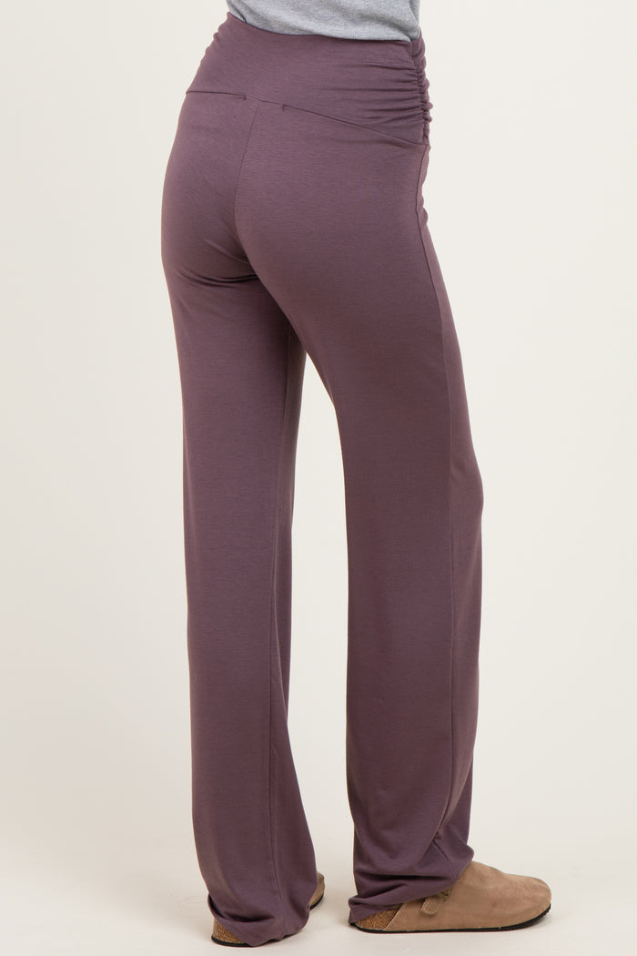 woman wearing purple ruched waistband pants viewed from the back