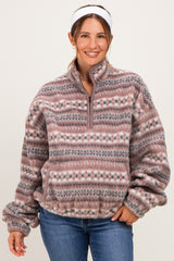 woman wearing a pink and gray patterned fleece pullover maternity wear with a half zip and relaxed fit