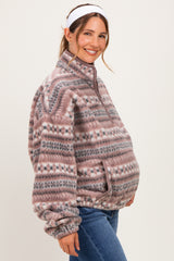 woman wearing a cozy patterned fleece maternity pullover and showing her baby bump