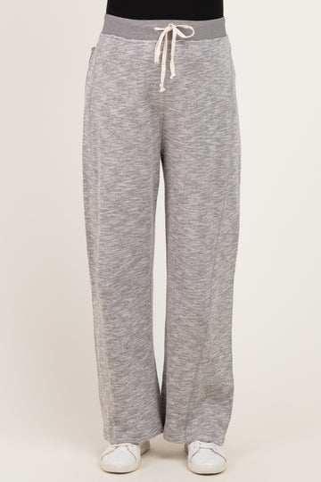 woman wearing gray maternity lounge pants with a drawstring waistband
