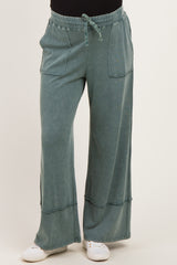 maternity wear wide leg green lounge pants with pockets and drawstring waist, model wearing it