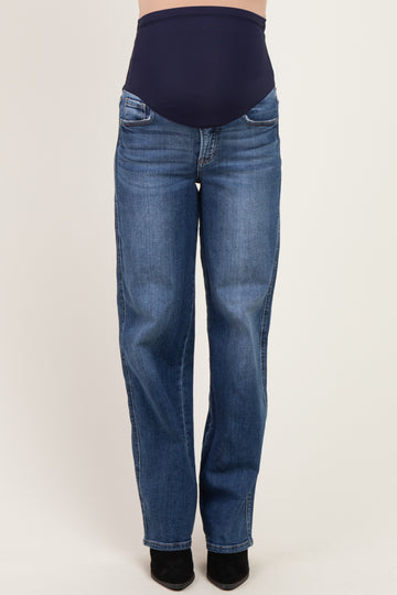 woman wearing dark blue maternity jeans with a supportive waistband and straight-leg fit