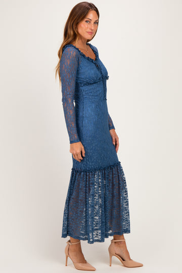 woman wearing a blue long sleeve lace maxi dress with a ruffled hem and a fitted bodice
