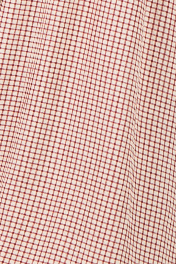 red and cream checkered fabric texture with a grid pattern