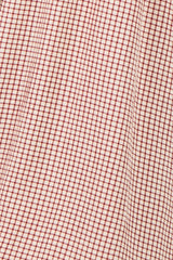red and cream checkered fabric texture with a grid pattern