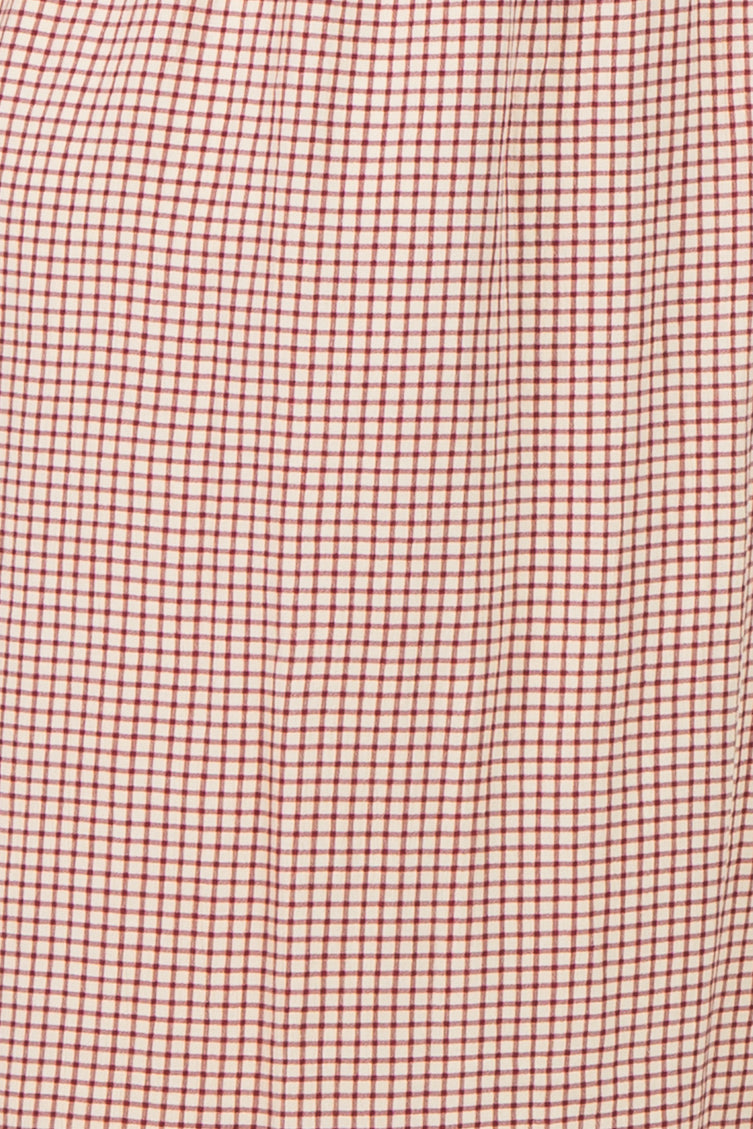 maternity wear in a red and white checkered pattern with a pleated design