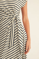 woman wearing a striped midi dress with a tied waist detail
