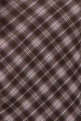 brown plaid fabric with diagonal lines and light purple accents