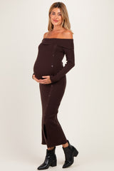 woman wearing a brown off-shoulder ribbed maternity dress with buttons and a visible baby bump