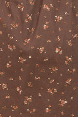 brown floral fabric with small multicolored flowers scattered throughout