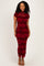 woman wearing a burgundy floral lace evening gown with short sleeves and a fitted silhouette