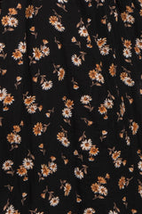 black floral midi skirt with orange and white daisy patterns