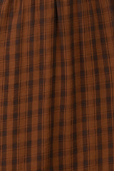 brown plaid midi skirt with a gathered waistline and soft fabric texture