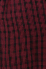 red and black plaid fabric, close-up view showing a textured pattern