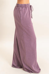 woman wearing a relaxed fit lavender maxi skirt with an elastic waistband and side pockets