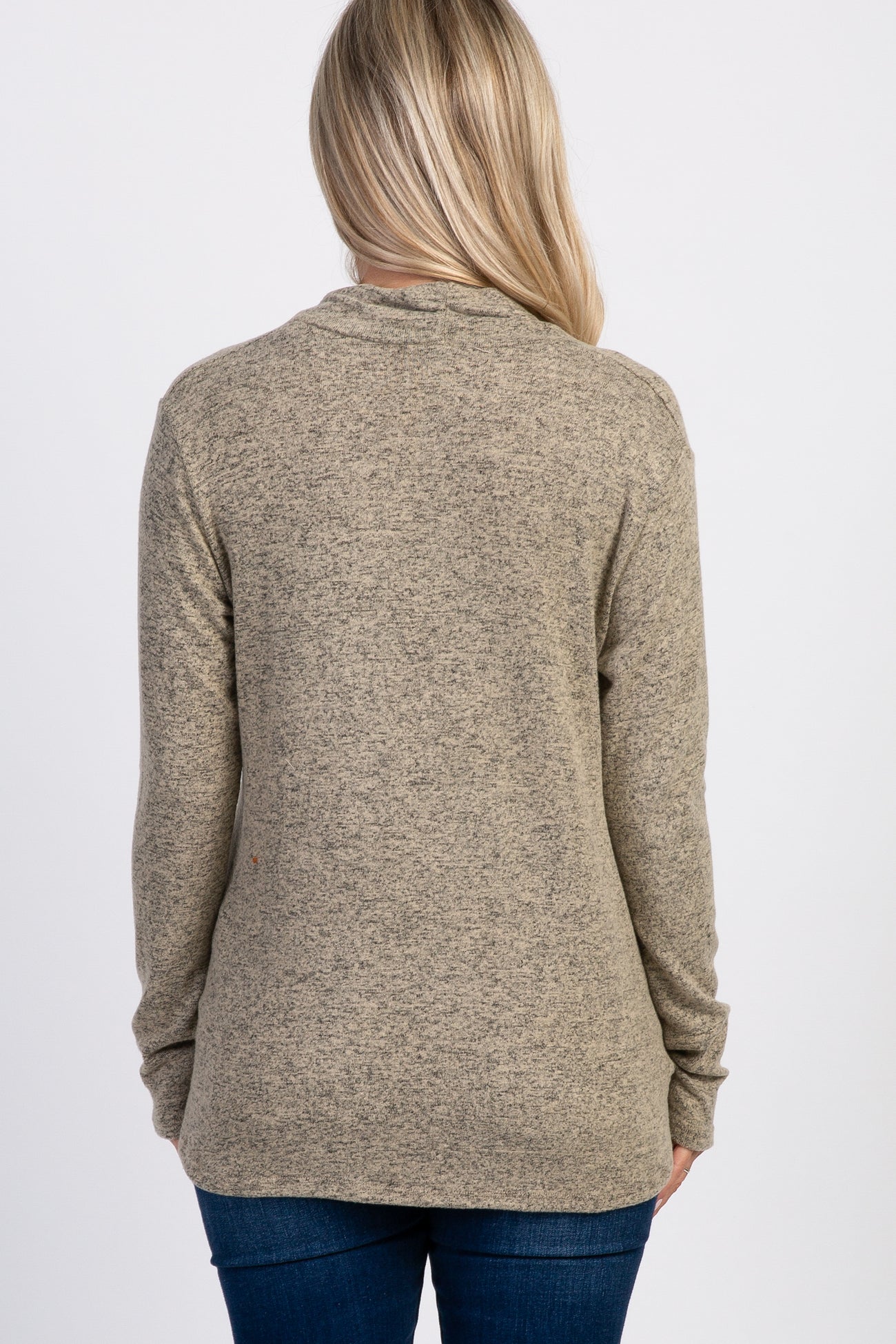 woman wearing a textured brown maternity top with long sleeves, shown from the back