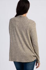 woman wearing a beige marled long sleeve sweater, showing the back view with relaxed fit and soft fabric