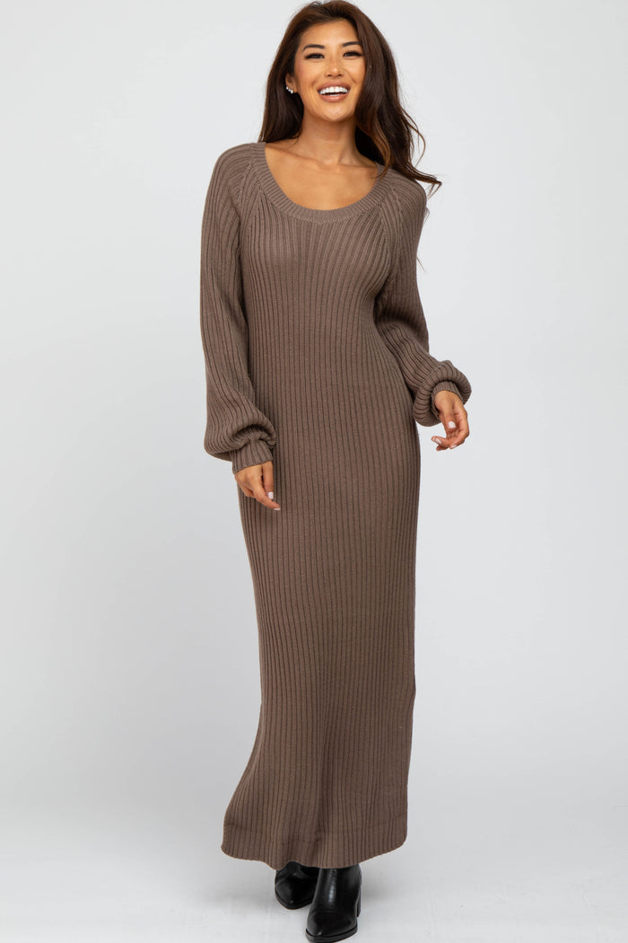 woman wearing a brown ribbed knit maxi dress with long sleeves and a scoop neckline