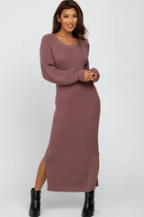 woman wearing a mauve long sleeve ribbed knit maxi dress with side slits and a v-neckline