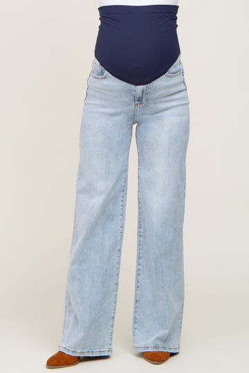 maternity wear light blue wide-leg jeans with a navy blue over-the-bump waistband