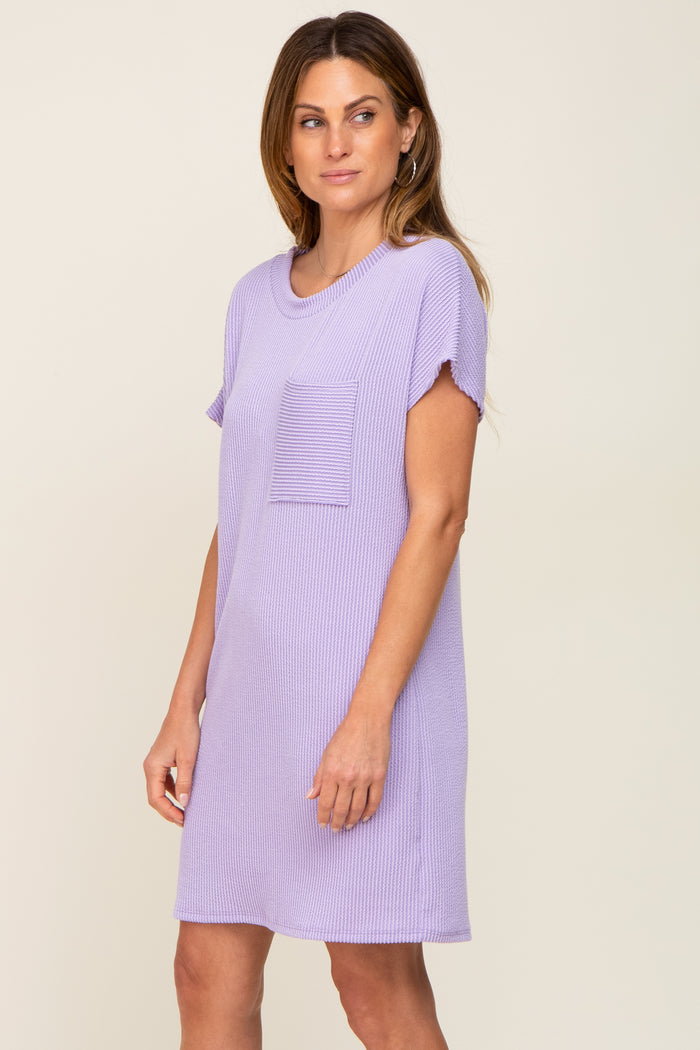woman wearing a light purple short sleeve ribbed dress with a pocket on the front