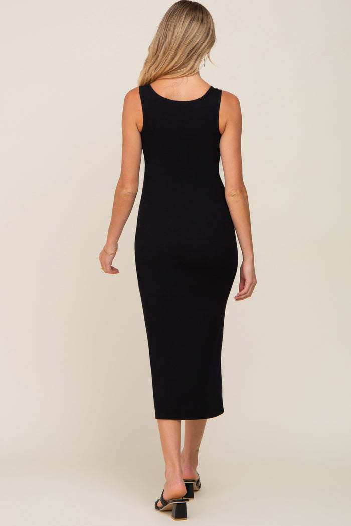 woman wearing a black ribbed maternity midi dress, showing the back view