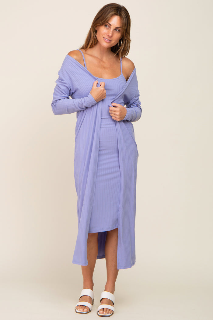 woman wearing a lavender ribbed midi dress and matching long cardigan set with white sandals
