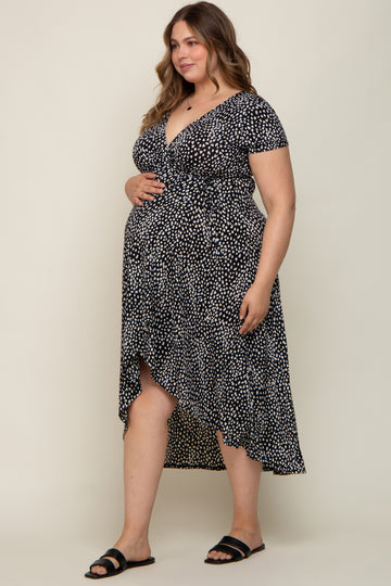 pregnant woman in black and white animal print maternity wrap dress with high-low hemline