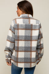 woman wearing a maternity flannel shirt in gray and brown plaid, showing the back view with long sleeves and a relaxed fit