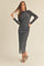 woman wearing a fitted gray long sleeve midi dress with a slight sheen and posing with her hair down