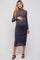 woman wearing a gray long sleeve maternity dress with ruching and a visible baby bump