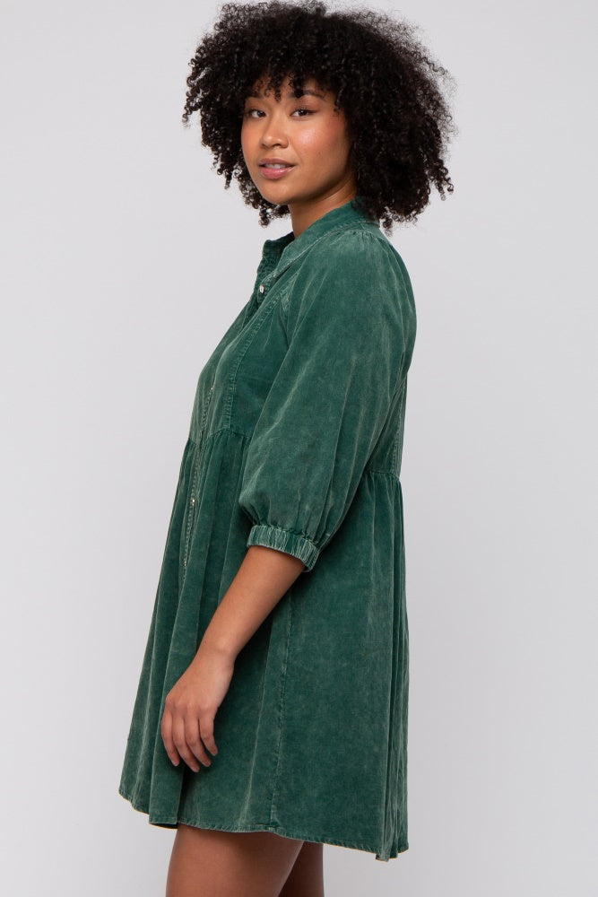 woman wearing a green puff sleeve shirt dress with a button-up front and a relaxed fit