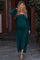 woman wearing a dark green ribbed maternity dress with long sleeves and a baby bump visible