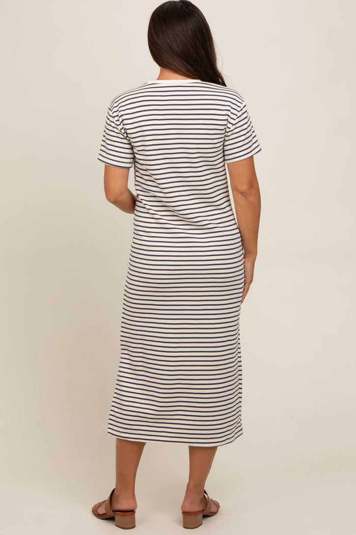 woman wearing a striped maternity maxi dress with short sleeves, seen from the back