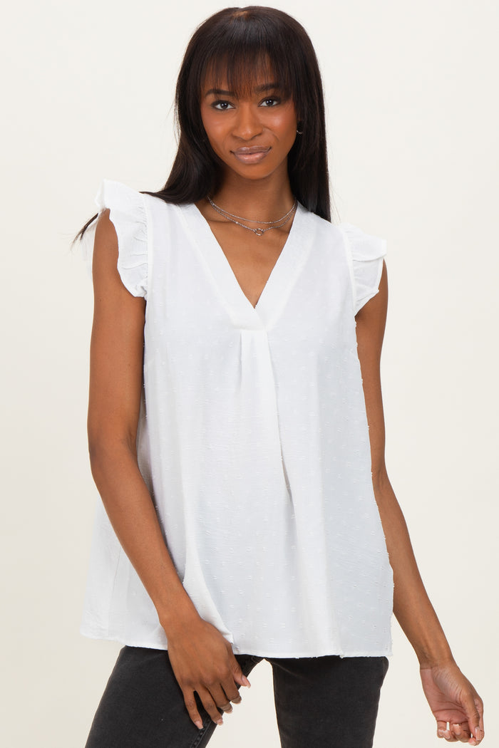 woman wearing a white sleeveless blouse with ruffled sleeves and a v-neckline